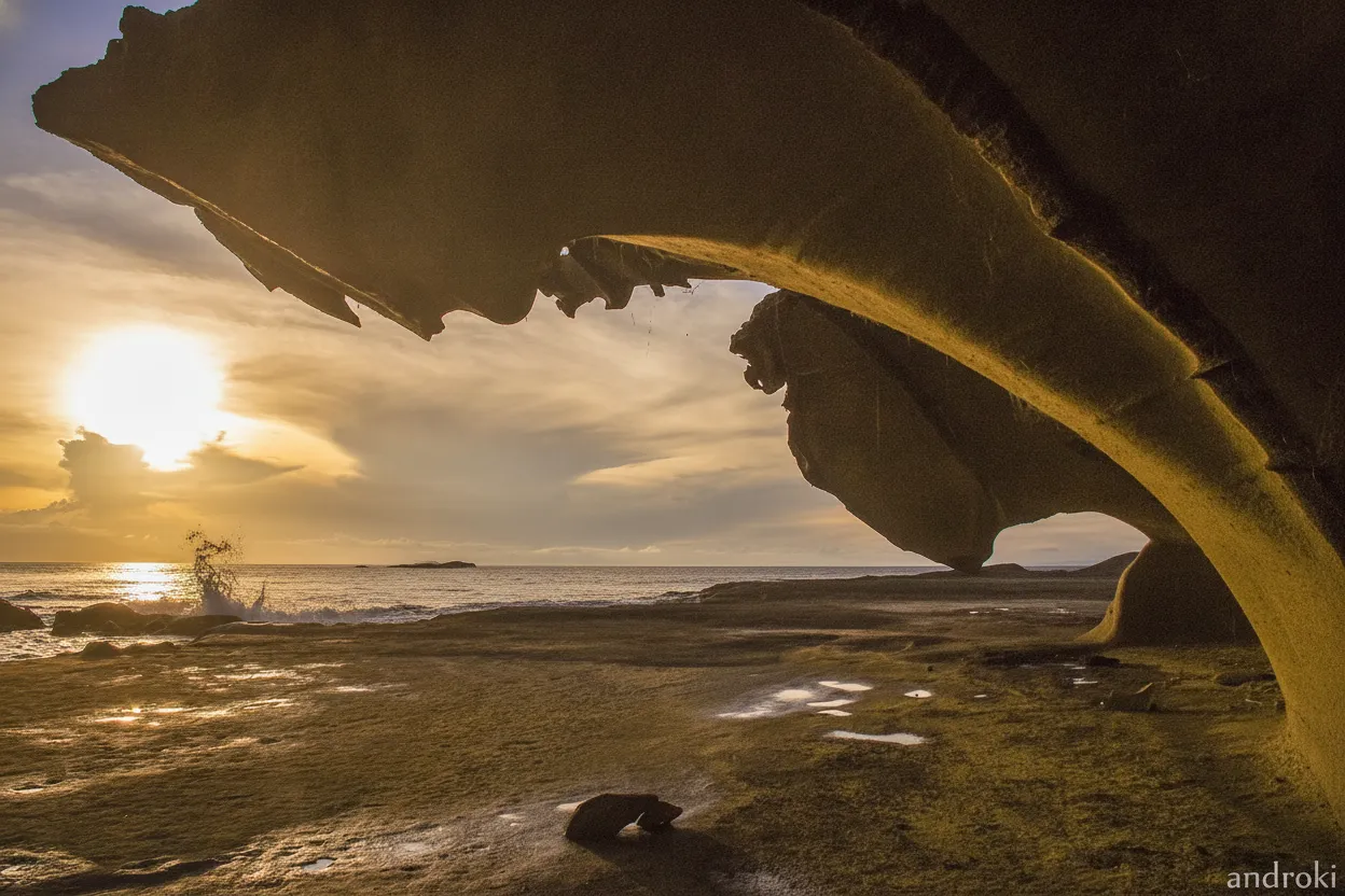 Witness a dramatic, alien landscape where colossal rock monoliths rise from the sea, sculpted by millennia of wind and waves into nature's own brutalist masterpieces.