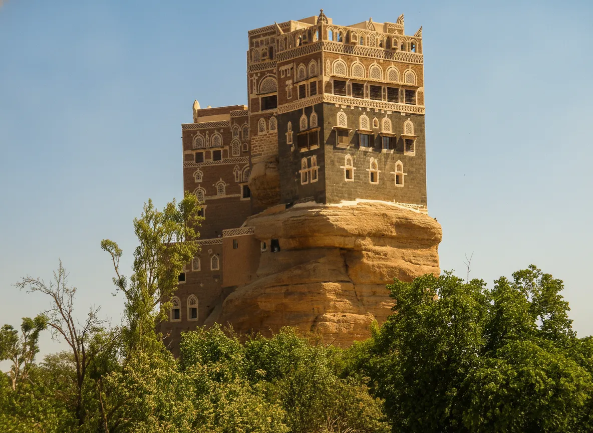 Dar al-Hajar, the Rock Palace, standing majestically on its rock pinnacle in Wadi Dhar, Yemen.