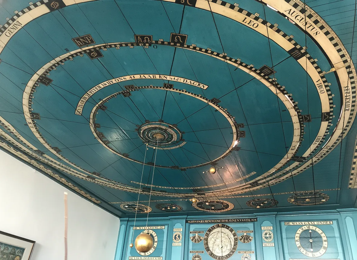 The intricate, hand-crafted orrery on the ceiling of Eise Eisinga's living room, showing the planets of the solar system.