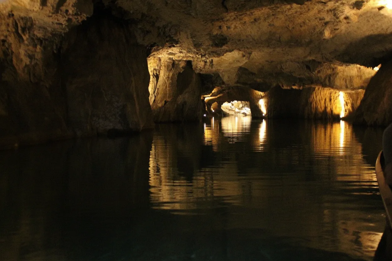 Imagine gliding silently across the vast, glassy surface of Europe's largest navigable underground lake, hidden deep beneath the Swiss Alps.