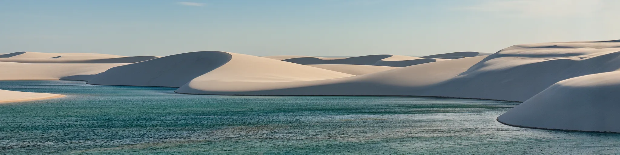 Imagine an endless expanse of brilliant white sand dunes, sculpted by the wind, yet inexplicably studded with thousands of crystal-clear freshwater lagoons that appear and disappear with the seasons.