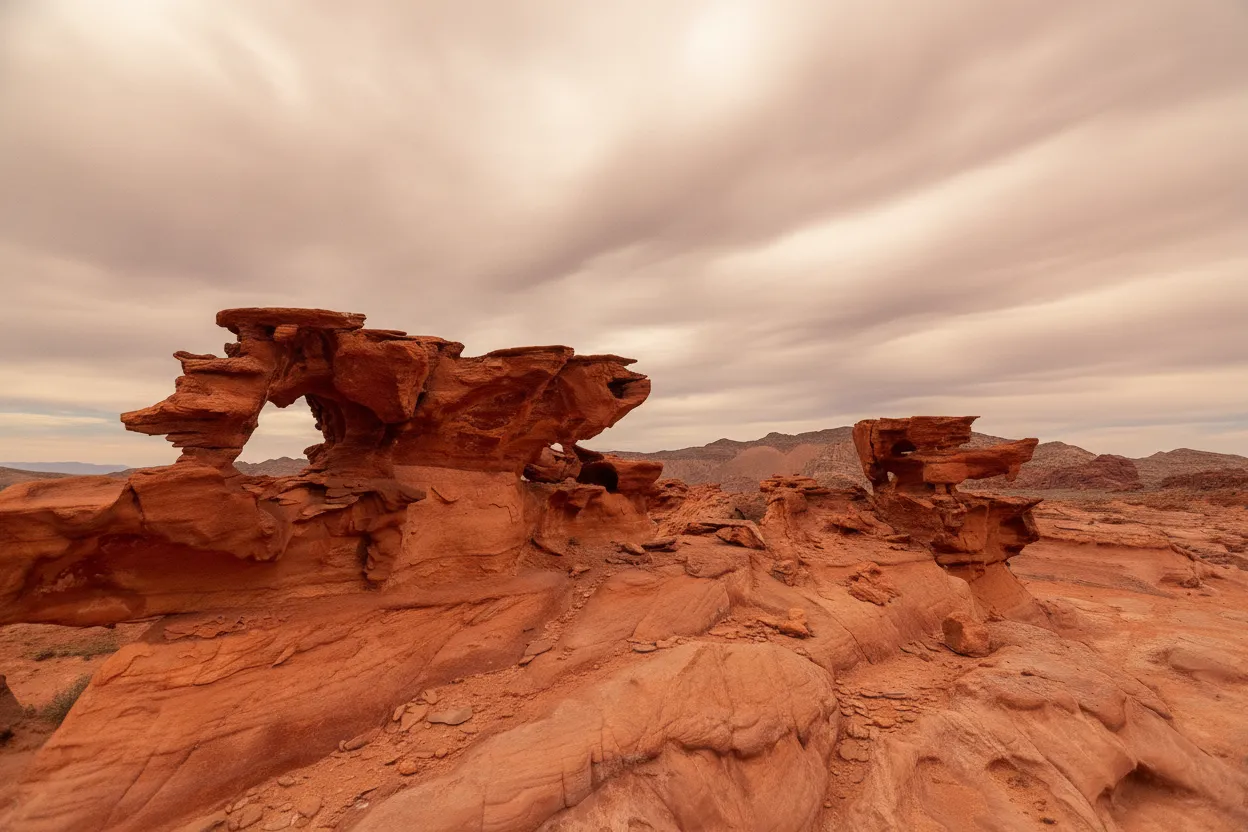 Abstract and intricate red rock formations resembling melting candles or alien structures at Little Finland.