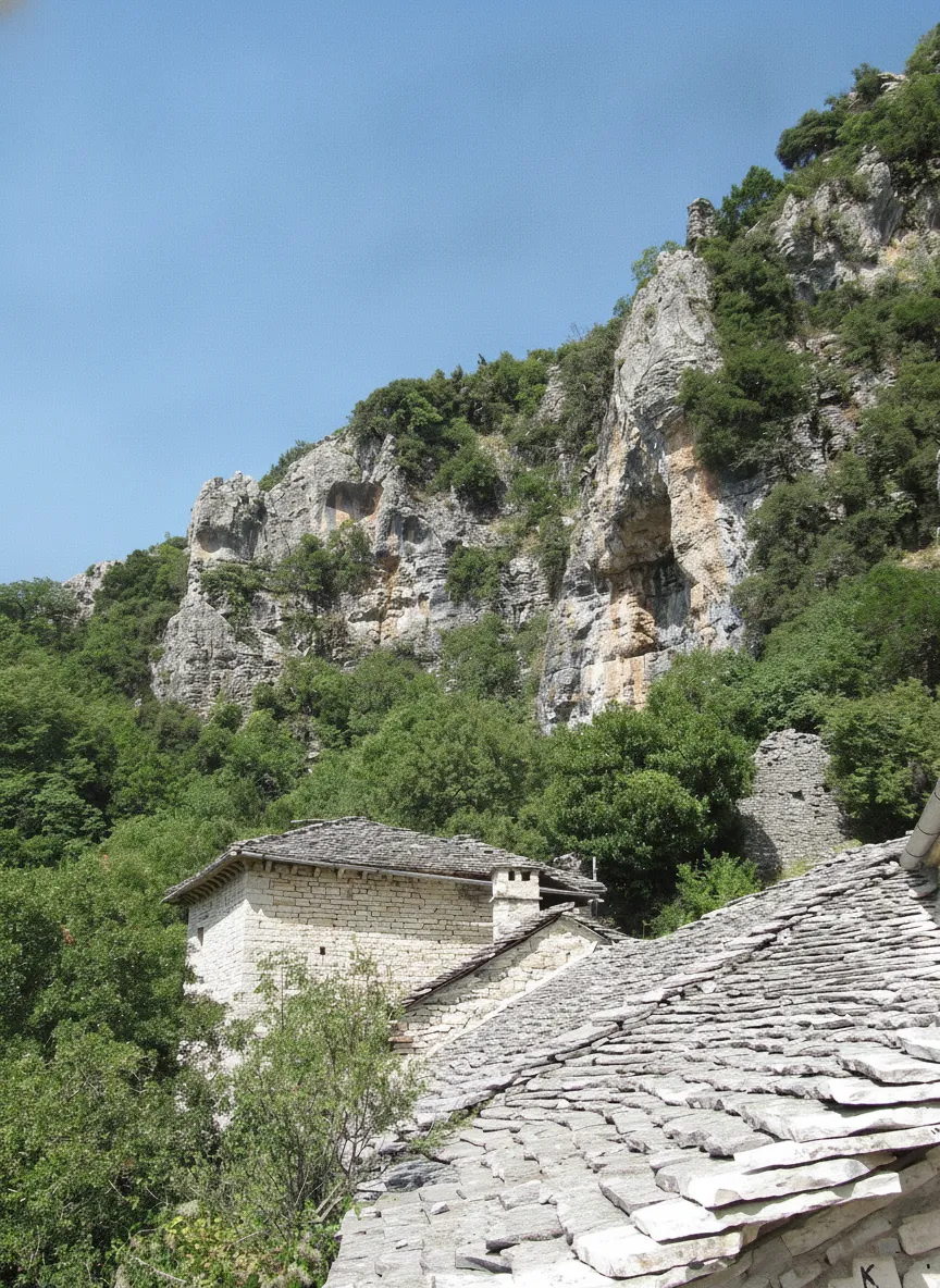 The Monastery of Saint Paraskevi clinging to the cliff face overlooking Vikos Gorge.