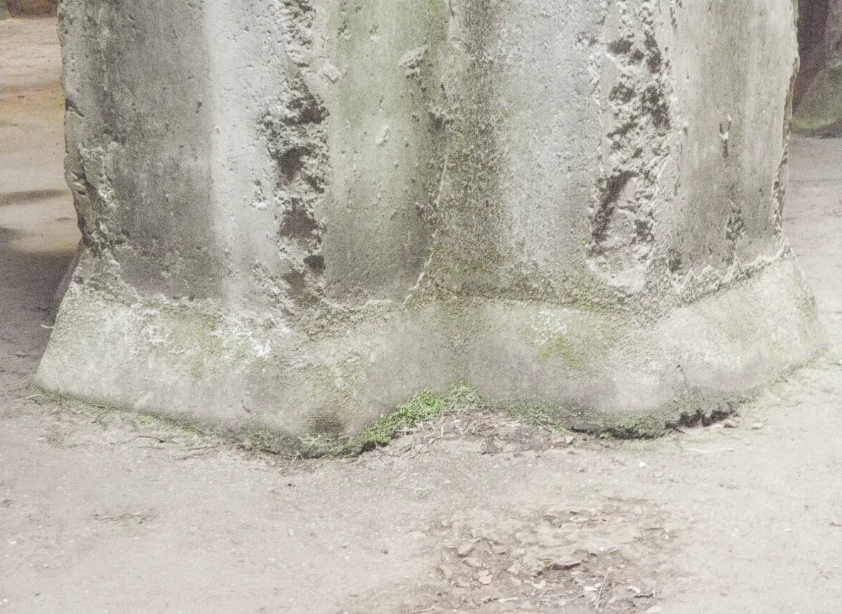 A person stands amidst the vast pillars of Piscina Mirabilis, providing a sense of scale and depth to the ancient Roman cistern.