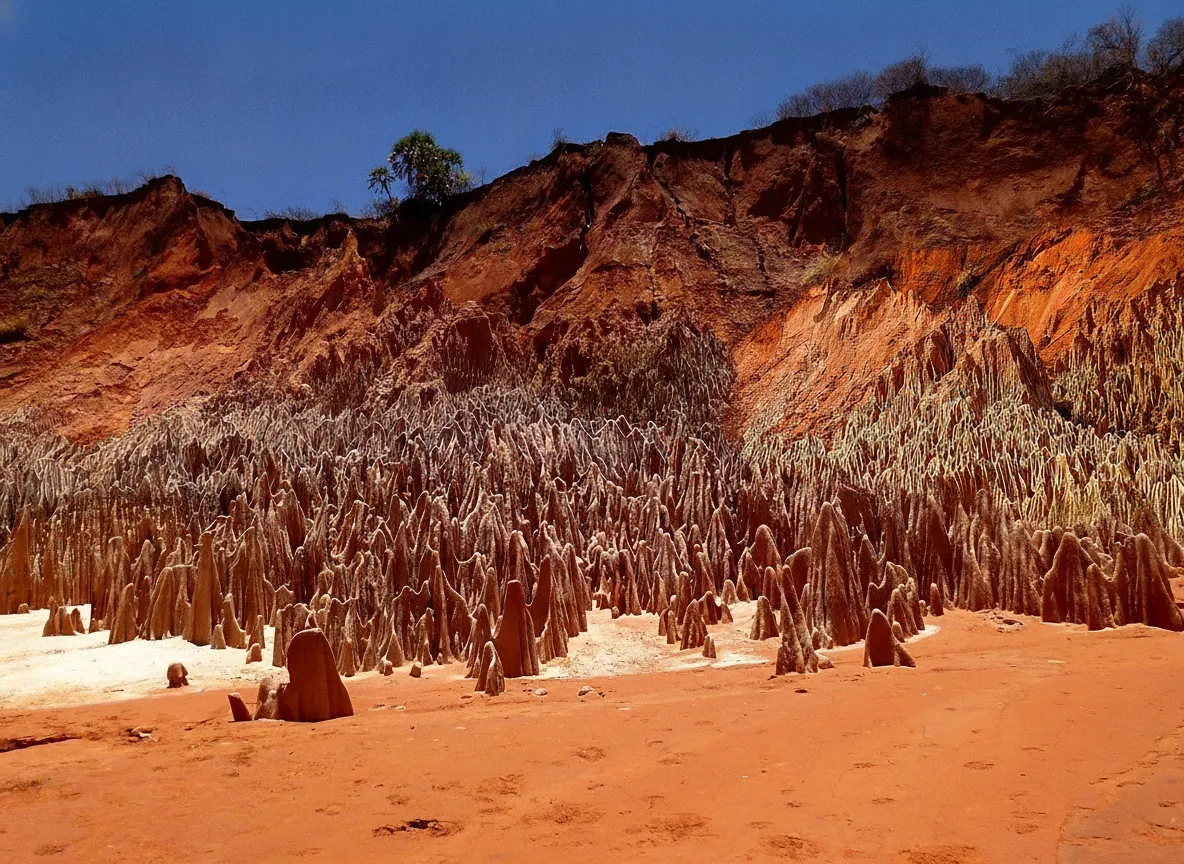 Close-up view of delicate, multi-layered sandstone and laterite formations in Tsingy Rouge, showing intricate erosion patterns.