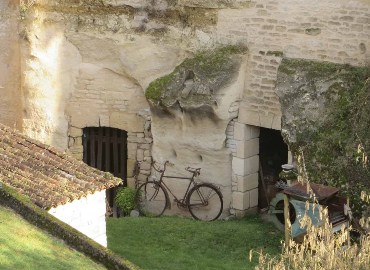 Entrance to a troglodyte home carved into the tufa rock at Rochemenier, France
