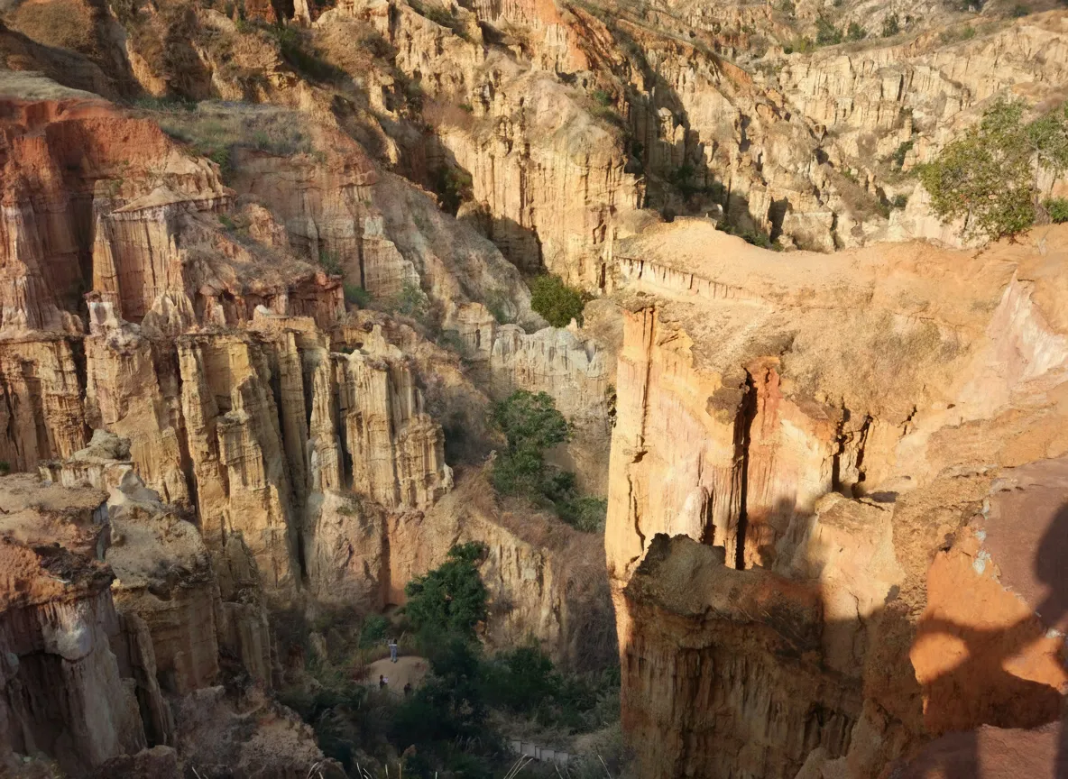 Imagine an entire forest sculpted not from trees, but from towering pillars of clay and sand, carved over millennia by wind and water into fantastical, alien landscapes.